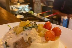 Beef-Fillet-Stuffed-w-Apples-soaked-in-Cointreau-honey-vanilla-goat-cheese.-Topped-w-peppercorn-wine-cheese-sauce-w-garlic-mashed-potatoes-marinated-cherry-tomatoes