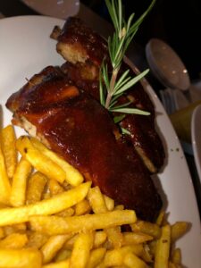 Smoked Pork Back Ribs with French Fries at Toro Loco Restaurant